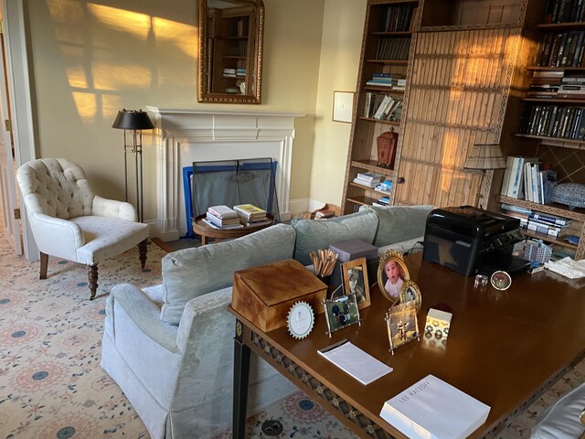399 Hermits Point Rd, Islesboro, ME 04848 - living area featuring a glass covered fireplace and baseboards