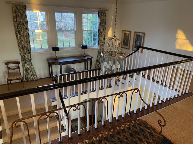 399 Hermits Point Rd, Islesboro, ME 04848 - stairs featuring a notable chandelier