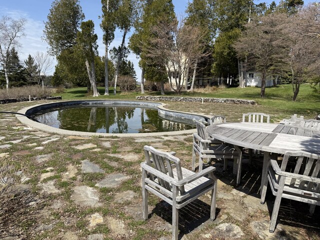 399 Hermits Point Rd, Islesboro, ME 04848 - surrounding community with a swimming pool, outdoor dining space, and a yard
