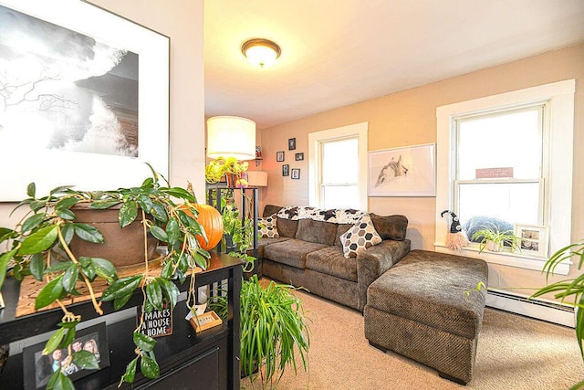 living room with a wealth of natural light and a baseboard heating unit