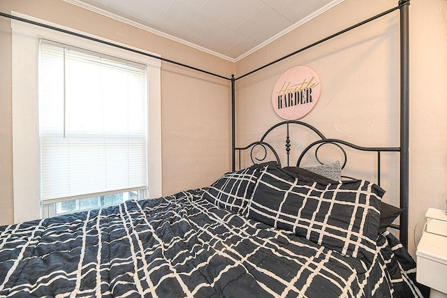 bedroom featuring crown molding