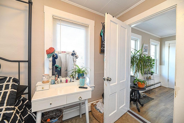 interior space with hardwood / wood-style floors and ornamental molding