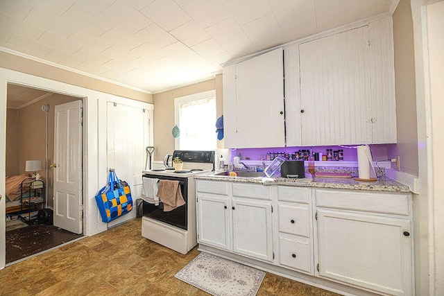 kitchen featuring light stone countertops, ornamental molding, sink, white electric stove, and white cabinets