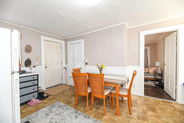 dining area featuring ornamental molding