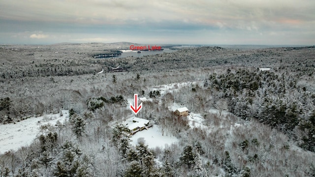 snowy aerial view with a mountain view