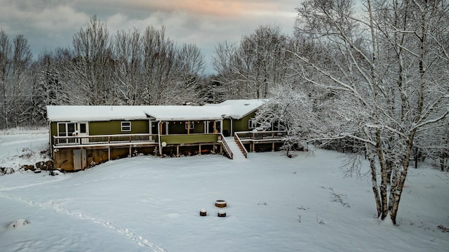 view of front of home featuring a wooden deck