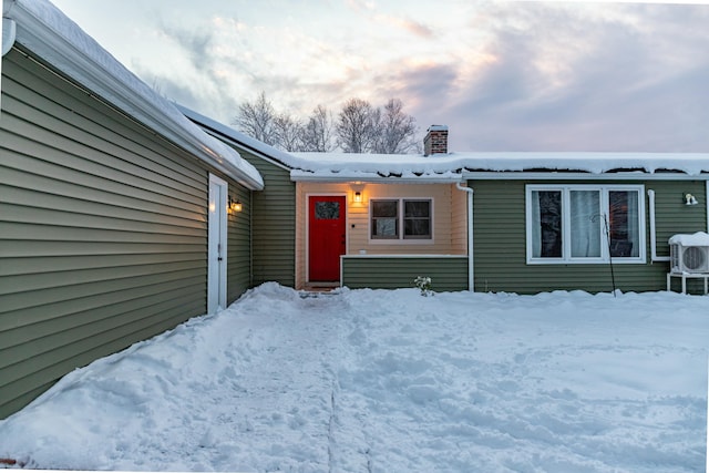 view of front of property featuring ac unit