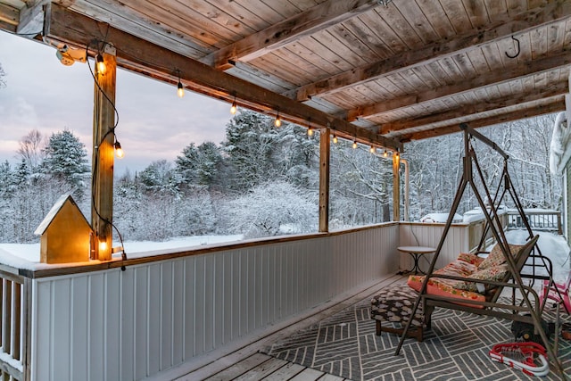 view of snow covered deck