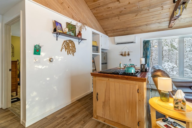 kitchen with wood ceiling, stainless steel appliances, vaulted ceiling, a wall unit AC, and light hardwood / wood-style flooring