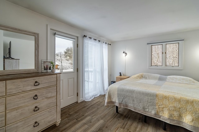 bedroom with hardwood / wood-style flooring