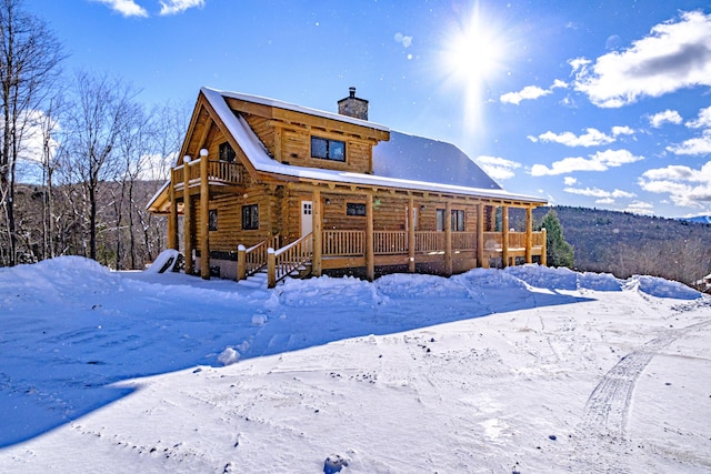 view of snow covered house