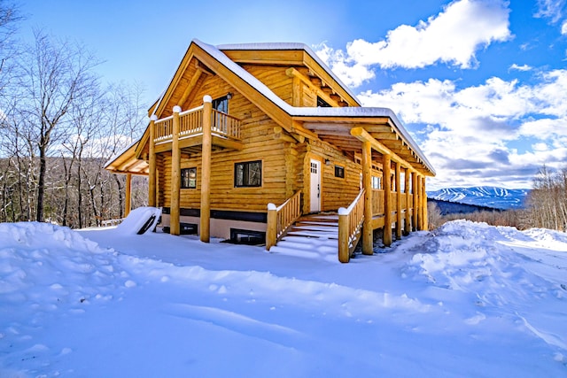 log-style house with a balcony