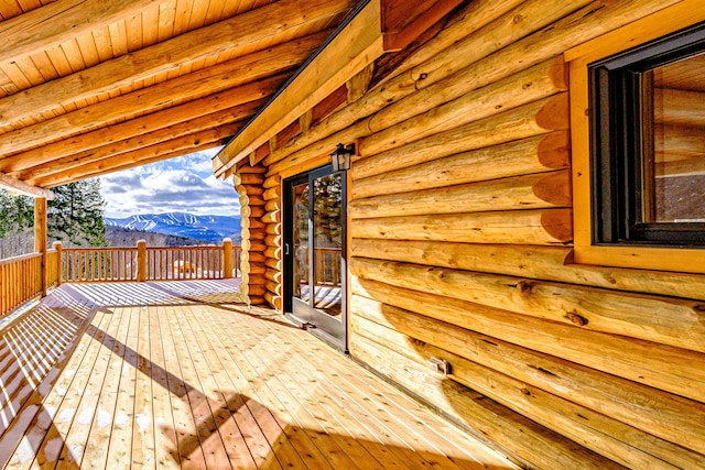 wooden terrace featuring a mountain view