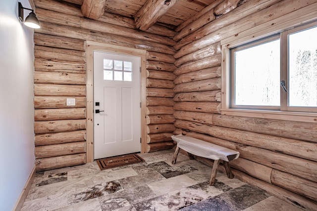 entryway featuring log walls, beamed ceiling, and wooden ceiling