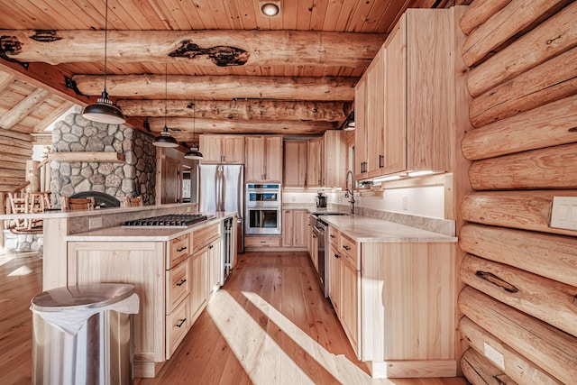 kitchen with beam ceiling, light hardwood / wood-style floors, rustic walls, and wooden ceiling