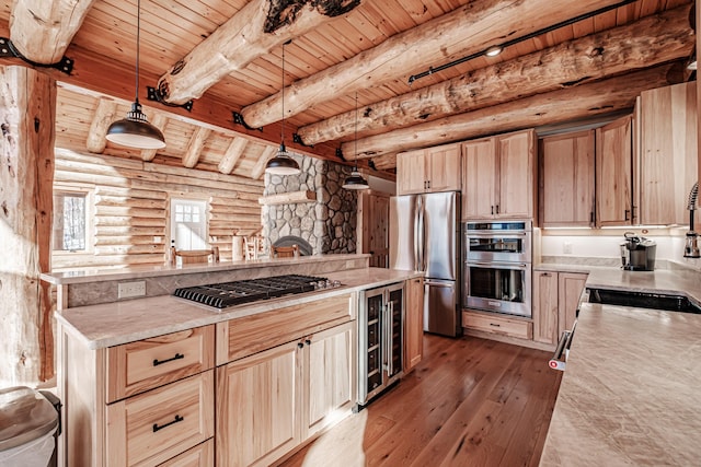 kitchen featuring wine cooler, beamed ceiling, hardwood / wood-style floors, wood ceiling, and appliances with stainless steel finishes