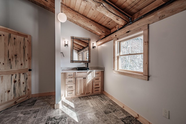 bathroom with lofted ceiling with beams, wood ceiling, and vanity