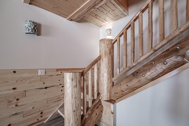 stairs with hardwood / wood-style floors and wood ceiling