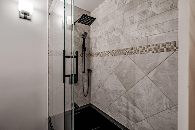 bathroom with tiled shower