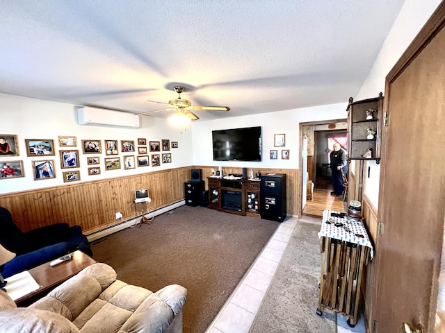 living room featuring baseboard heating, a wall mounted AC, a textured ceiling, wooden walls, and light tile patterned flooring