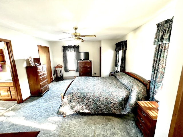 bedroom featuring baseboard heating, ceiling fan, and carpet