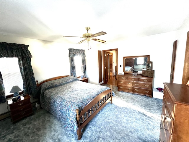 bedroom with ceiling fan and dark carpet