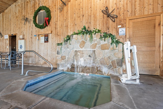 view of swimming pool featuring a community hot tub