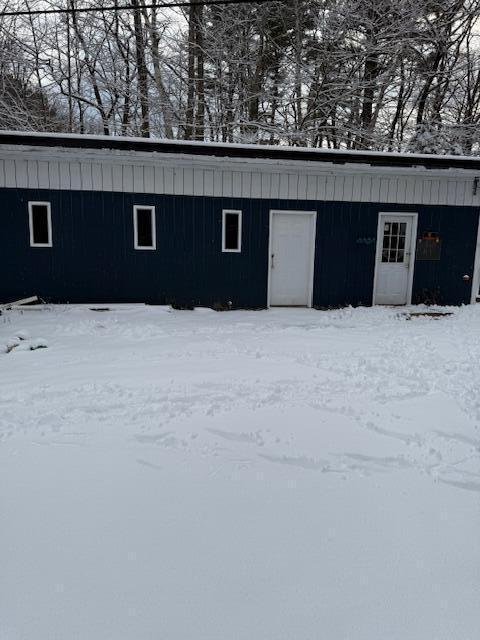 view of snow covered garage