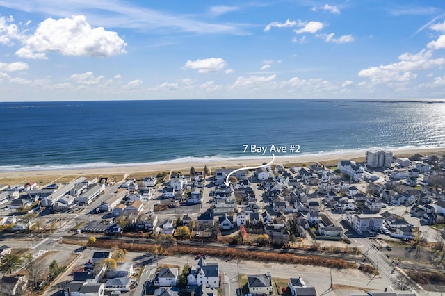 bird's eye view featuring a water view and a view of the beach