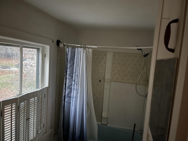 bathroom featuring shower / tub combo with curtain