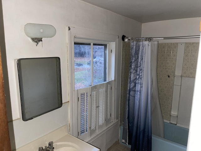 bathroom featuring vanity and shower / bath combo with shower curtain