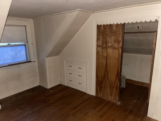 bonus room featuring dark hardwood / wood-style floors