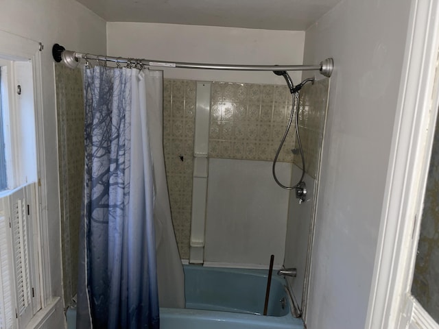 bathroom featuring shower / bathtub combination with curtain