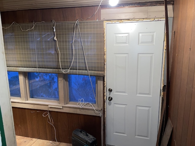 interior space featuring wood walls