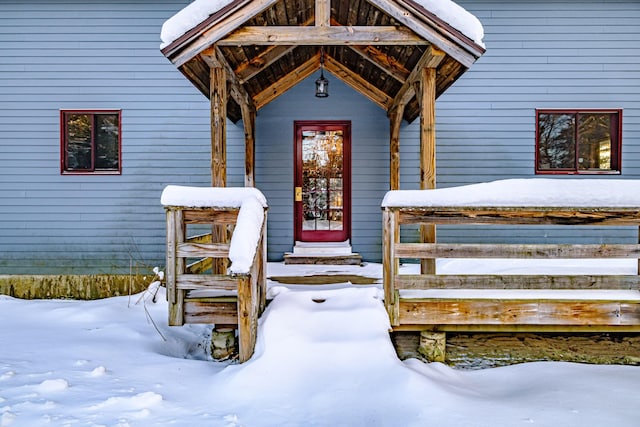 view of snow covered property entrance