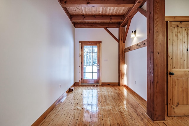 doorway to outside featuring beamed ceiling, wood ceiling, and light hardwood / wood-style flooring