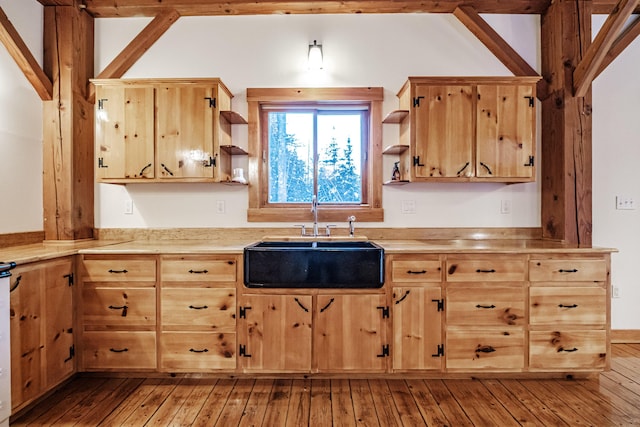 kitchen with light wood-type flooring and sink