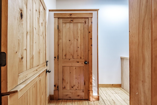 doorway with light hardwood / wood-style flooring