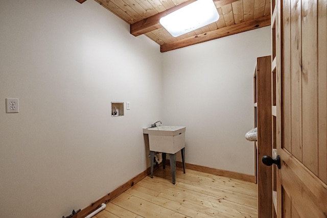 laundry room with washer hookup, light hardwood / wood-style flooring, and wooden ceiling