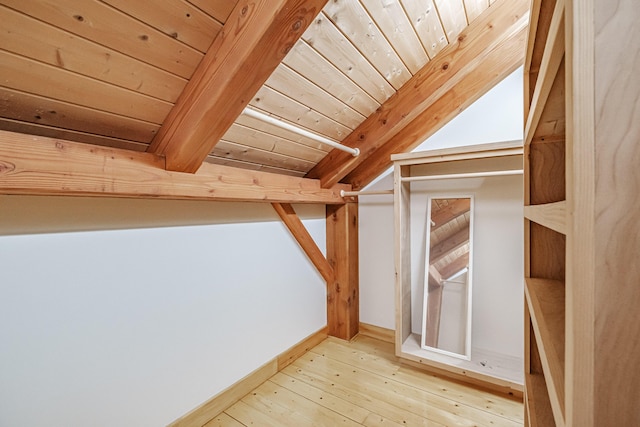 bonus room with lofted ceiling with beams, hardwood / wood-style flooring, and wood ceiling