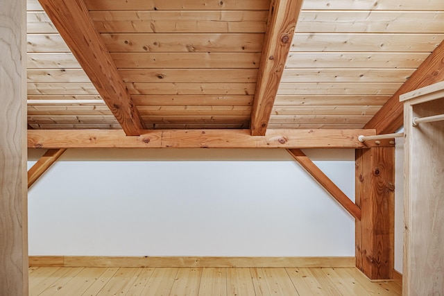 bonus room with wood-type flooring and wood ceiling