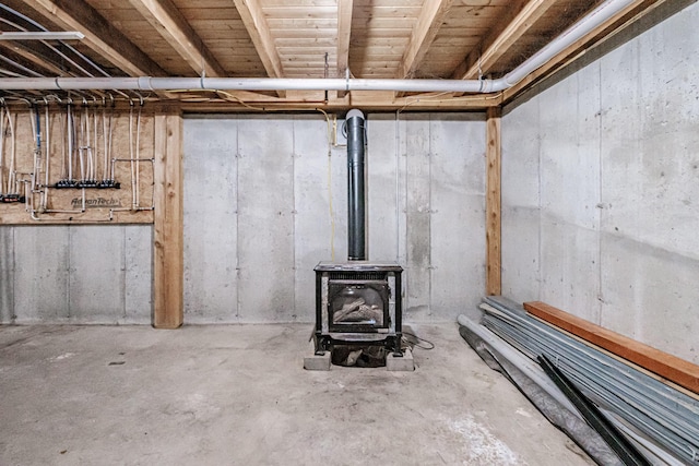 basement featuring a wood stove