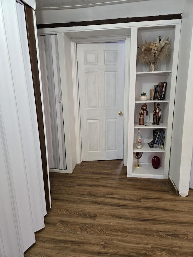 hall with dark hardwood / wood-style floors