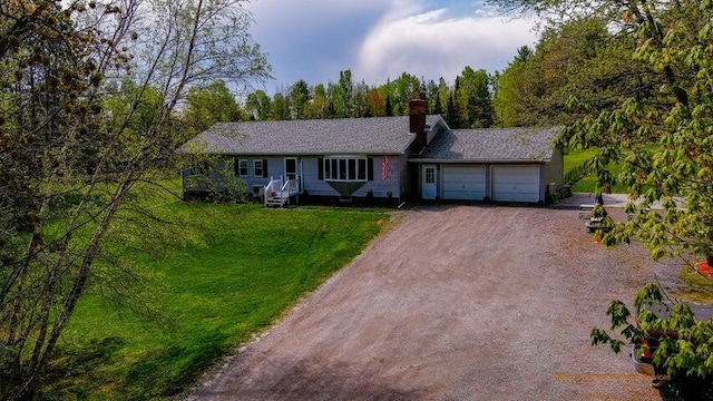 single story home with a front lawn and a garage