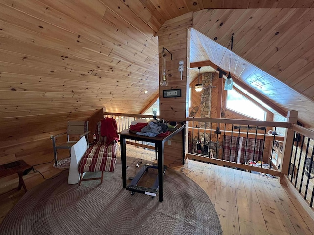 office with wooden walls, wood ceiling, vaulted ceiling, and hardwood / wood-style flooring