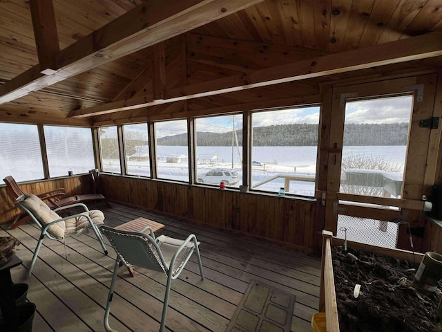 sunroom / solarium featuring wood ceiling, vaulted ceiling with beams, and a healthy amount of sunlight