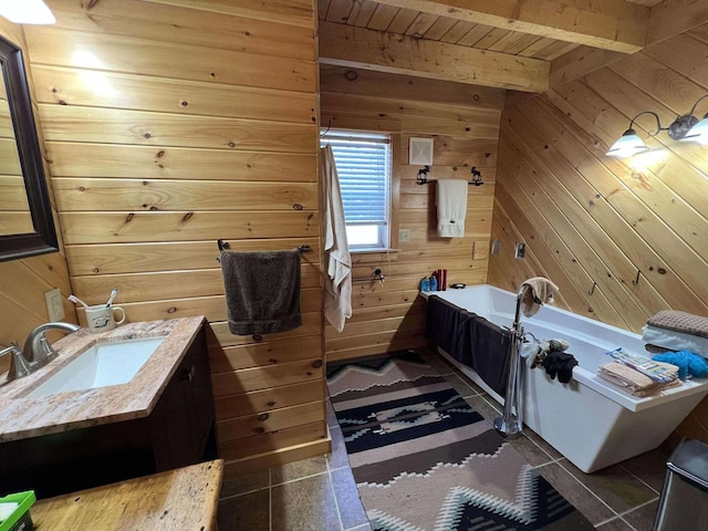 bathroom featuring vanity, a bathing tub, wooden walls, vaulted ceiling with beams, and wood ceiling