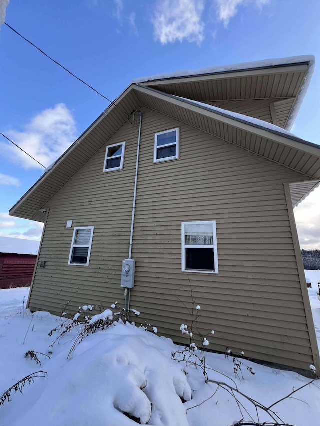 view of snow covered property