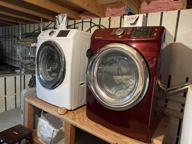 clothes washing area featuring washer and dryer