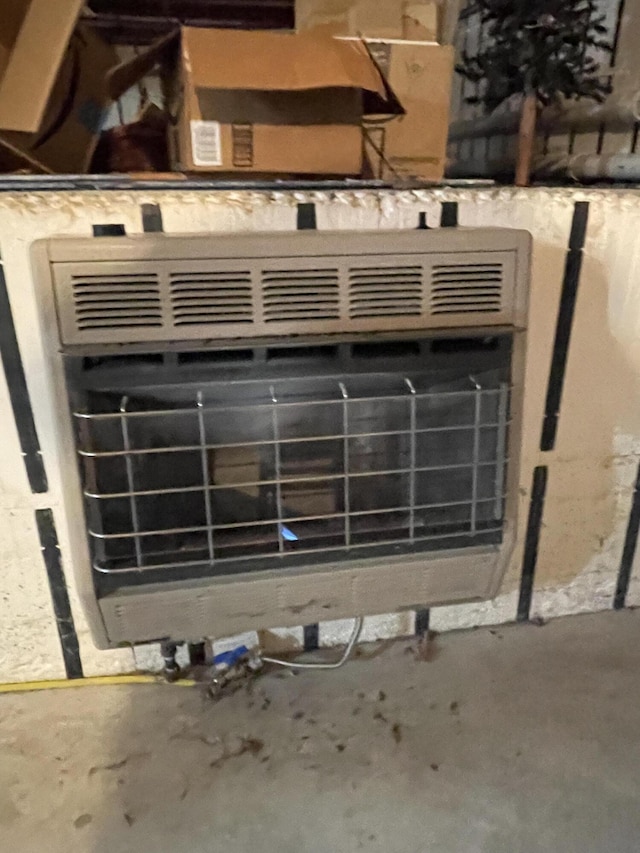 interior details featuring concrete flooring and heating unit